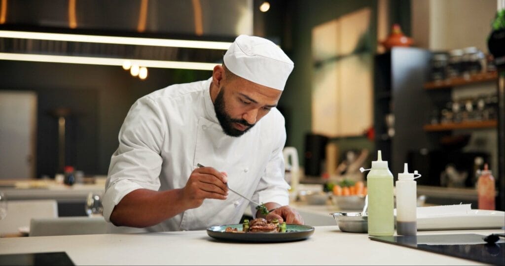 Chef plating food.